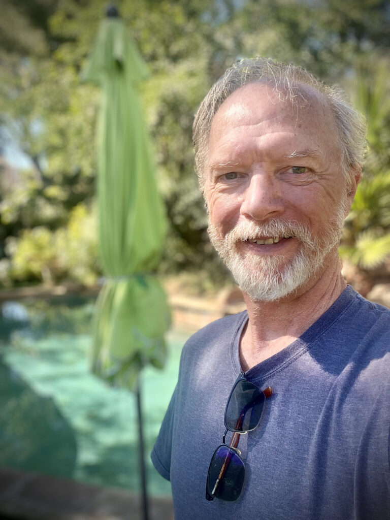Mike McNerney selfie without glasses by pool